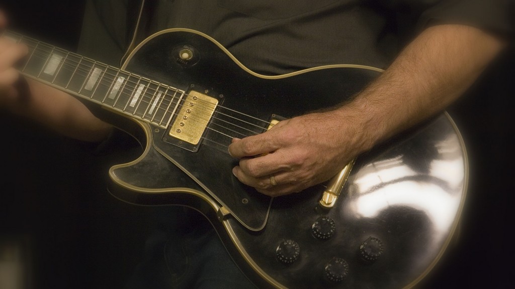 Pat+guitar+page+-background Pat Hurley playing black electric guitar
